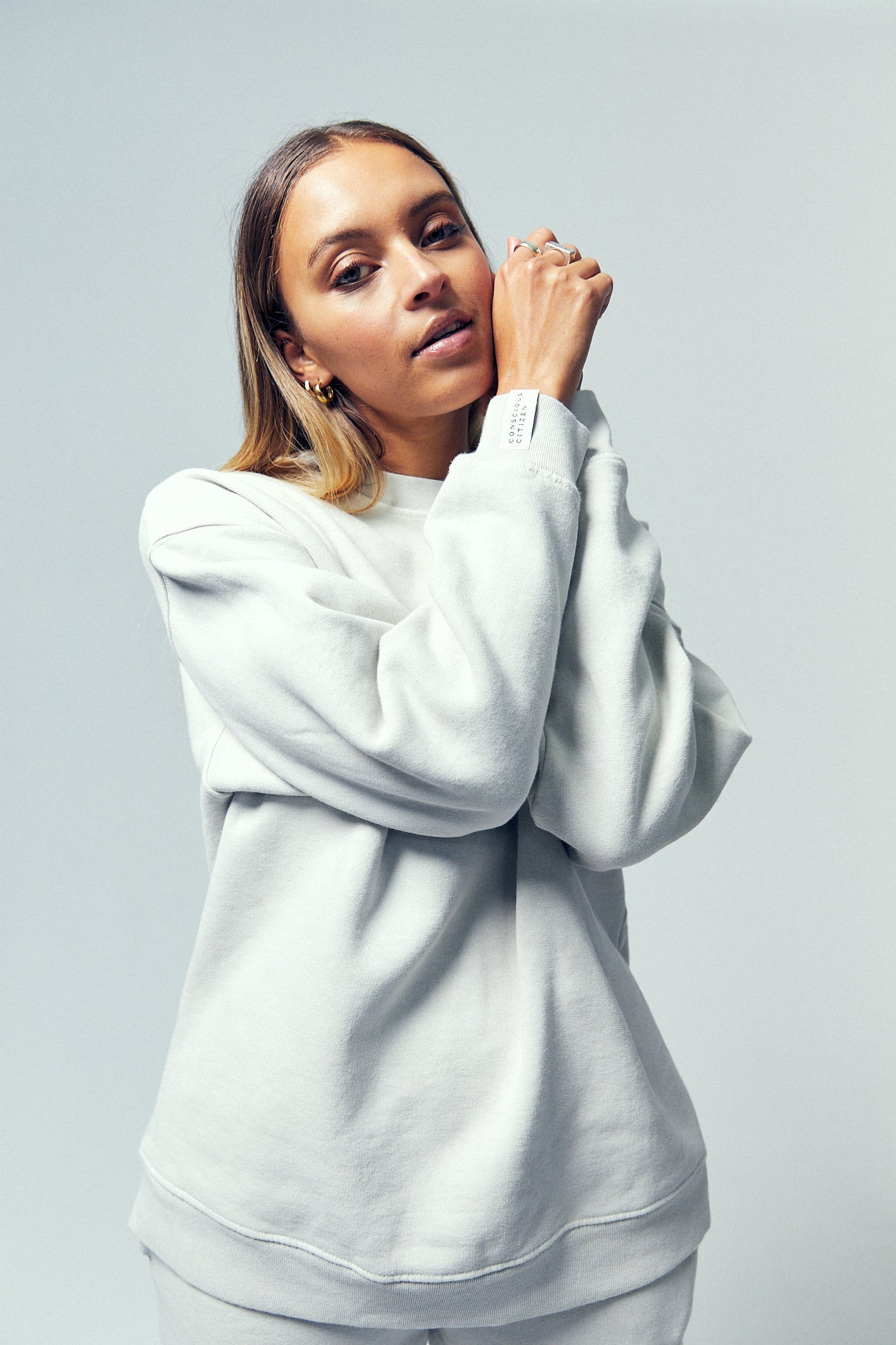 Cozy up in a sustainable cotton sweatshirt featuring a mindful and stylish design